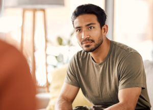 A man listening intently during a counseling session.